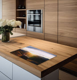inductiebeschermer hand naar zonsondergang keuken 2